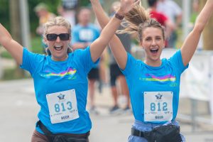 Women crossing finish line at cincinnati hyde park blast
